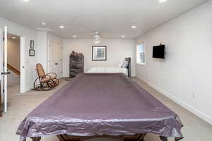 Bedroom with light carpet, a ceiling fan, and recessed lighting