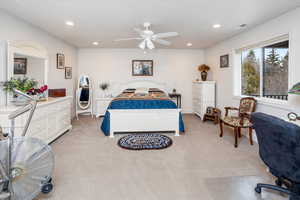 Bedroom with recessed lighting, light carpet, and a ceiling fan