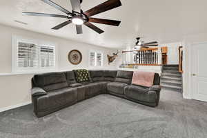 Living room featuring carpet and baseboards