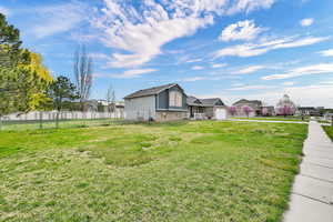 View of yard with an attached garage