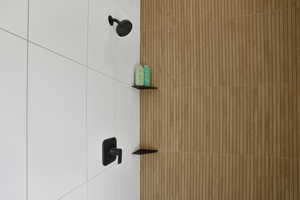 Bathroom view of a tile shower