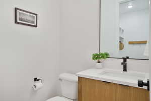 Half bath with toilet and vanity