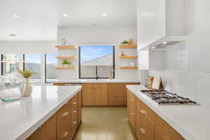 Kitchen featuring open shelves, recessed lighting, stainless steel gas cooktop, modern cabinets, and decorative backsplash