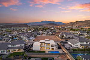Aerial view at dusk of a residential view and a mountain view