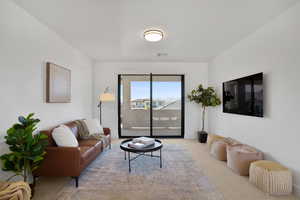 Living room featuring light carpet