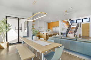 Dining space with recessed lighting and ceiling fan