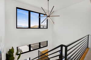 Stairway featuring hanging lights