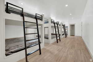 Unfurnished bedroom featuring light wood finished floors and recessed lighting