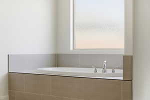 Full bathroom featuring a bath