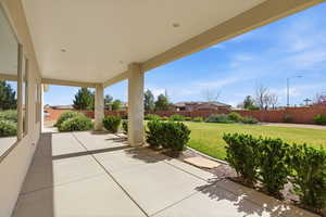 Fenced backyard with a patio area