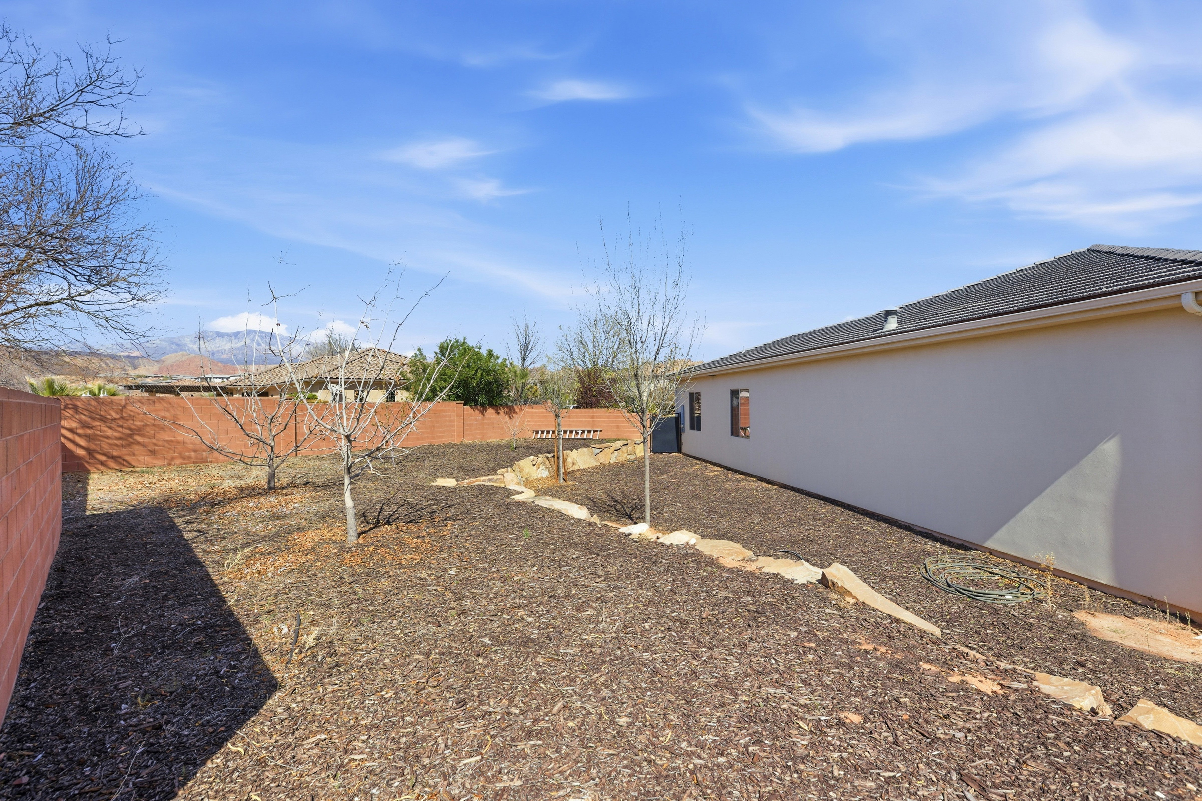 View of fenced backyard