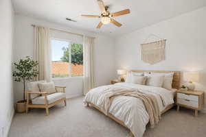 Bedroom with carpet flooring and ceiling fan