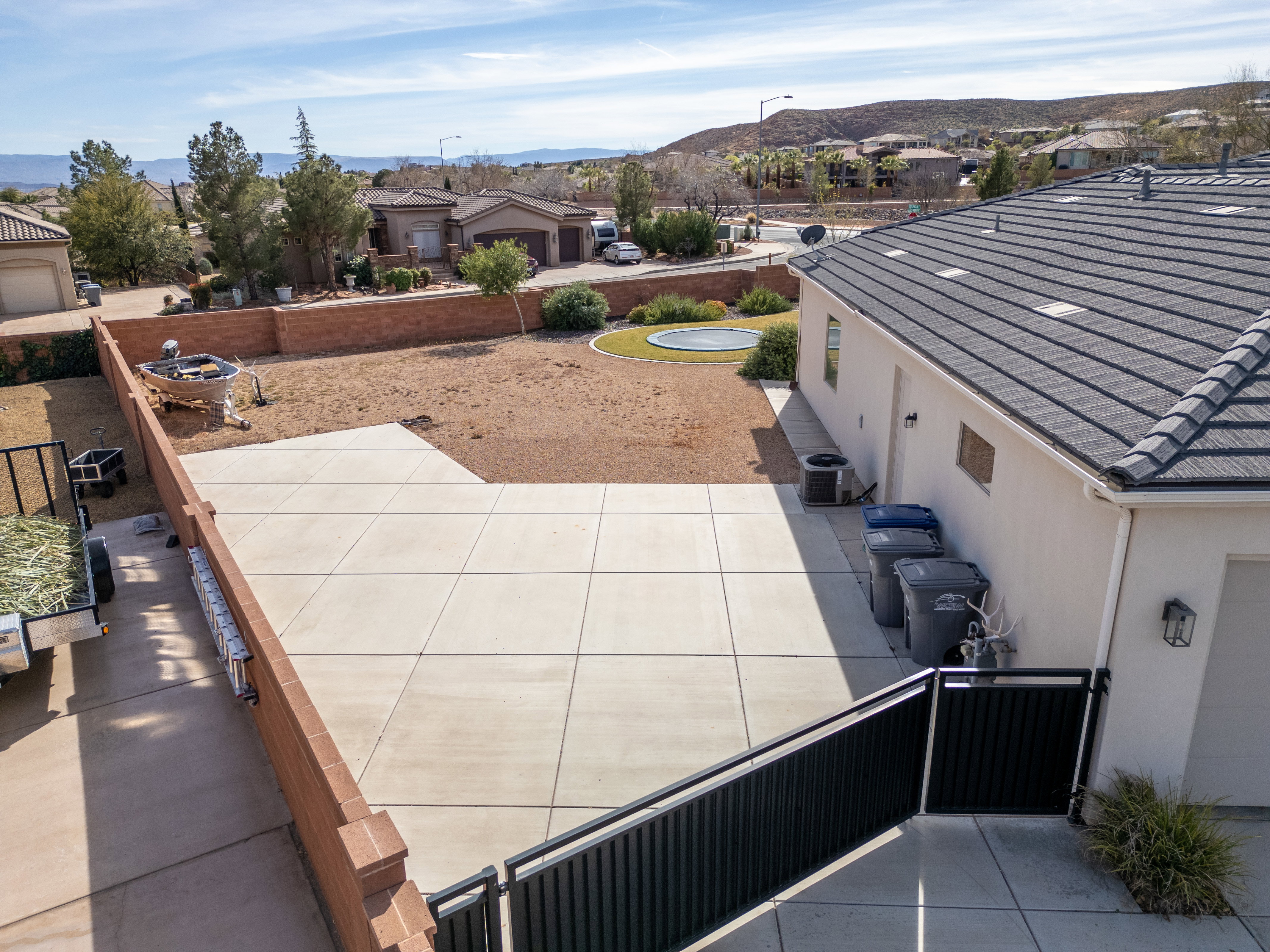 Aerial perspective of suburban area featuring a mountain backdrop