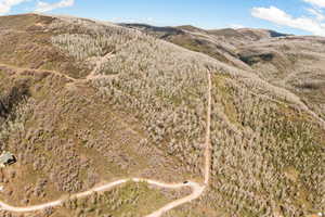 View of mountain background featuring rural landscape
