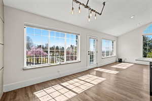 Interior space featuring lofted ceiling and light wood-type flooring