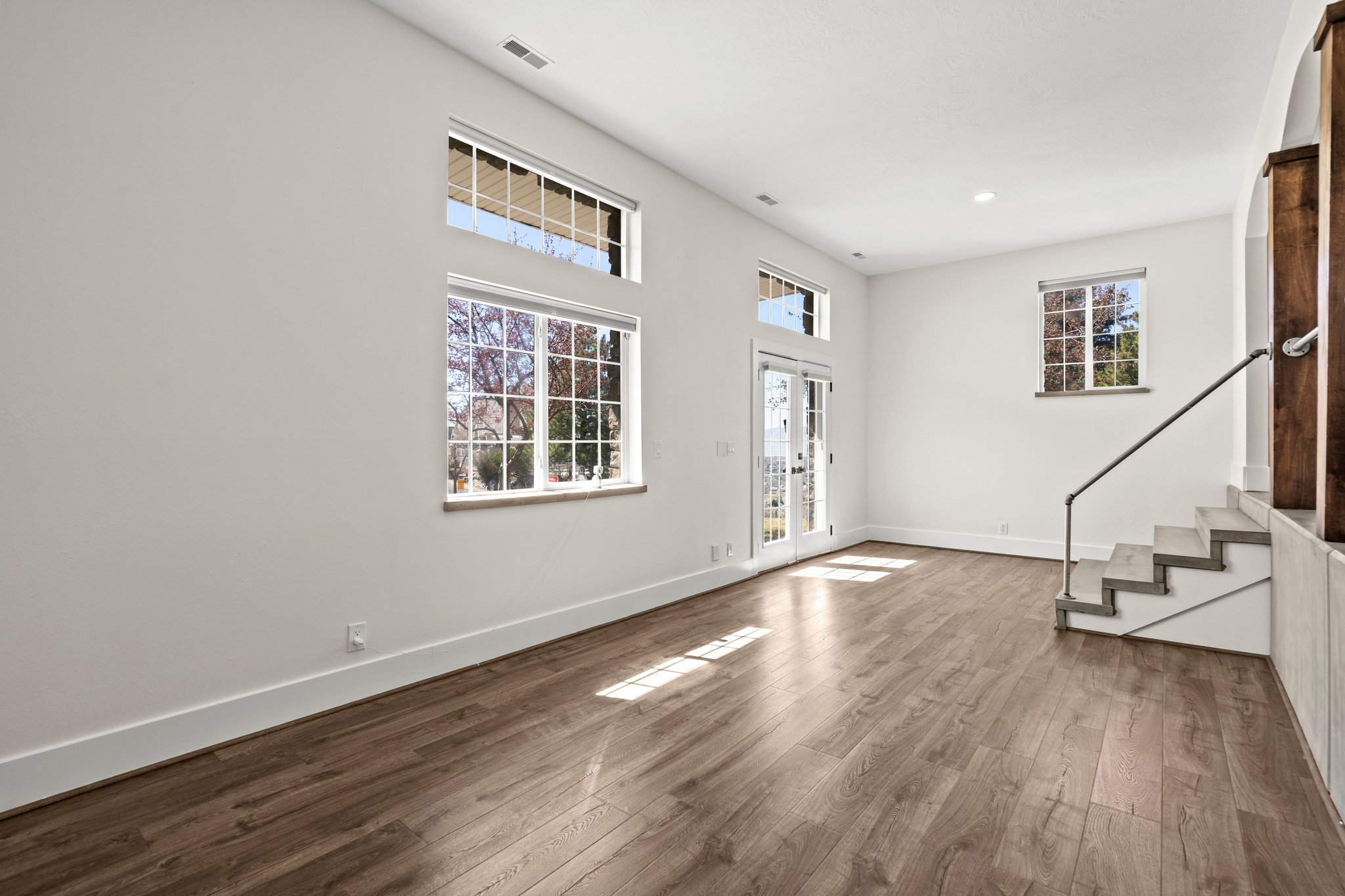 Entrance foyer with stairs and dark wood finished floors
