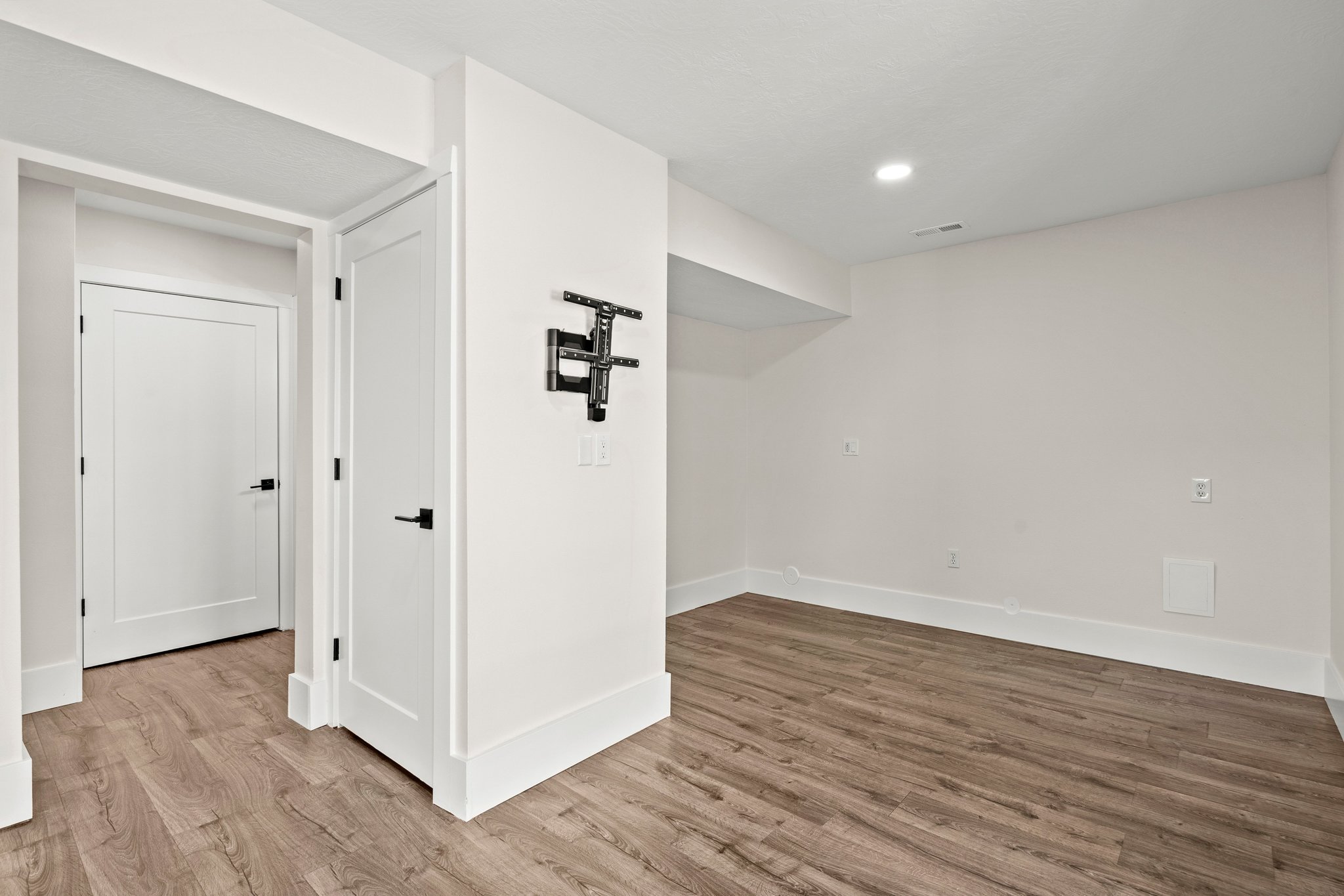 Basement featuring light wood finished floors and recessed lighting