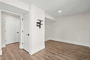 Basement featuring light wood finished floors and recessed lighting