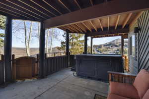 View of patio with a gate and a mountain view