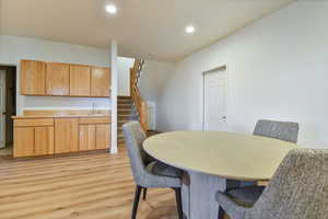 Dining space featuring light wood-style floors and recessed lighting