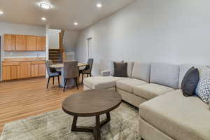 Living room featuring recessed lighting and light wood-style flooring