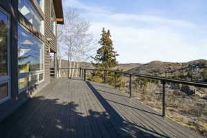 Wooden deck featuring a mountain view