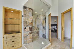 Full bathroom with a marble finish shower, ensuite bath, and recessed lighting