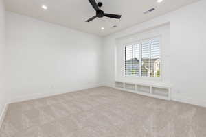 Unfurnished room featuring recessed lighting, light carpet, and ceiling fan
