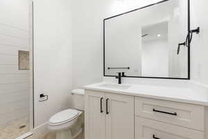 Full bathroom with vanity and tiled shower