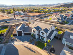 Aerial perspective of suburban area featuring a mountainous background