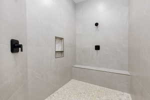 Bathroom featuring a tile shower