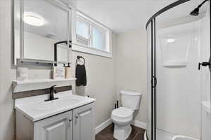 Full bathroom featuring vanity and a shower stall