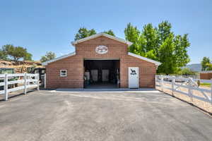 View of outbuilding with driveway