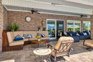 View of patio featuring ceiling fan and an outdoor lounge area