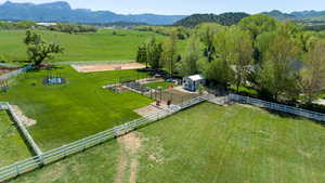 View of rural area featuring agricultural land and mountains