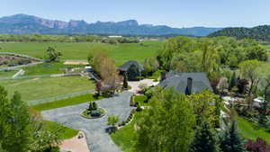 Aerial view of sparsely populated area with a mountain backdrop