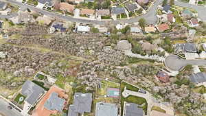 Aerial view of property's location with nearby suburban area