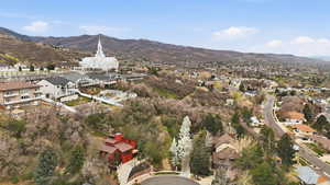 Aerial perspective of suburban area with a mountain backdrop