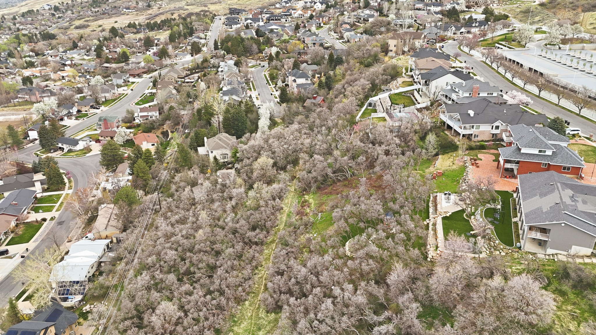 Aerial view of property's location featuring nearby suburban area