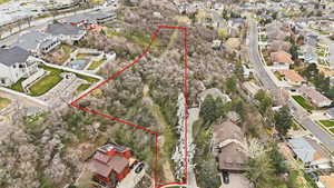 Aerial perspective of suburban area with property parcel outlined