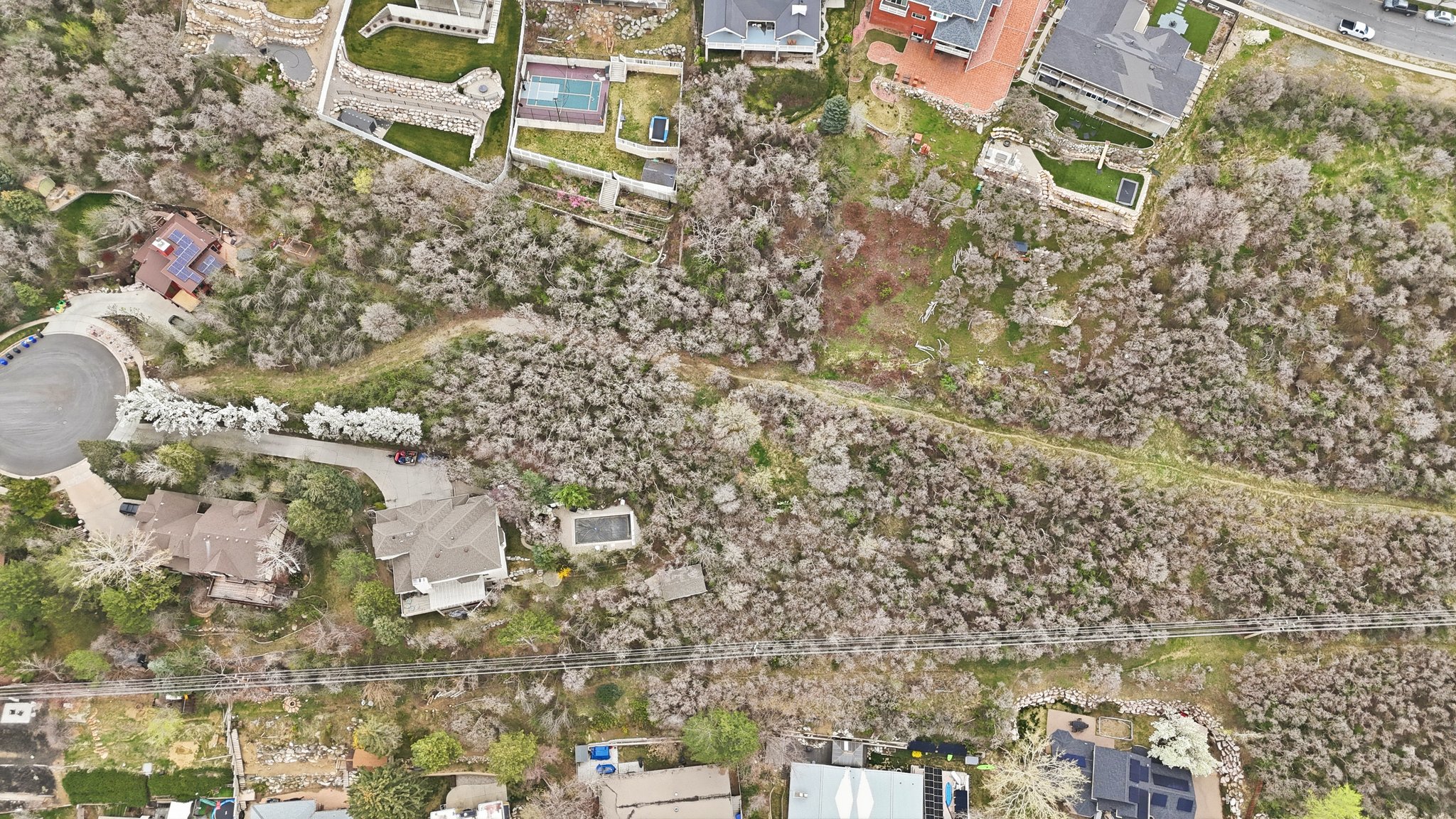 View of property location with nearby suburban area