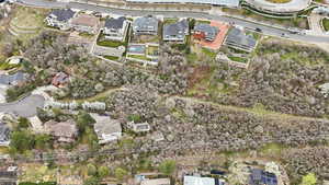 Aerial view of property's location featuring nearby suburban area