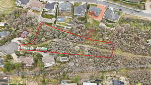 Aerial view of residential area with property boundaries highlighted