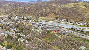 Aerial perspective of suburban area with a mountainous background