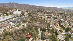 Aerial perspective of suburban area featuring a mountainous background