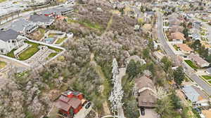 Aerial view of property's location featuring nearby suburban area