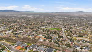 Aerial view of residential area featuring a mountain backdrop