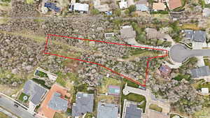 Aerial view of residential area featuring property parcel outlined