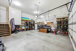 Garage featuring white fridge