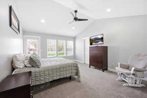 Bedroom featuring lofted ceiling, light colored carpet, a ceiling fan, access to exterior, and recessed lighting